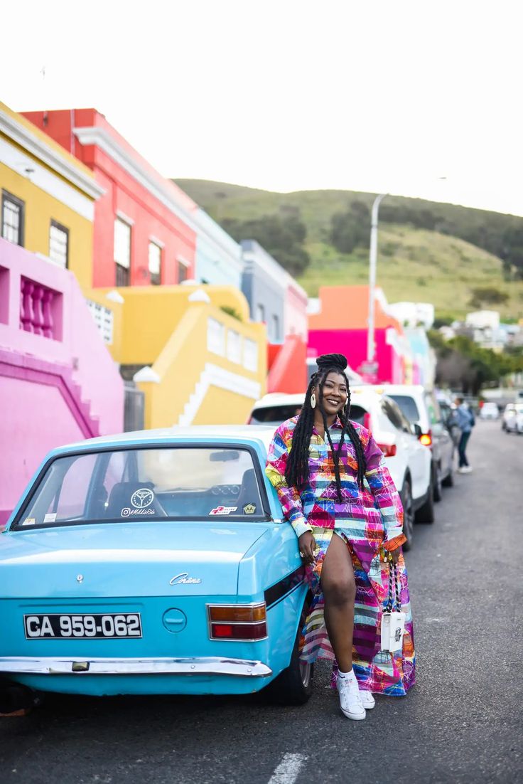 A traveler among the colorful homes of Bo-Kaap in Cape Town